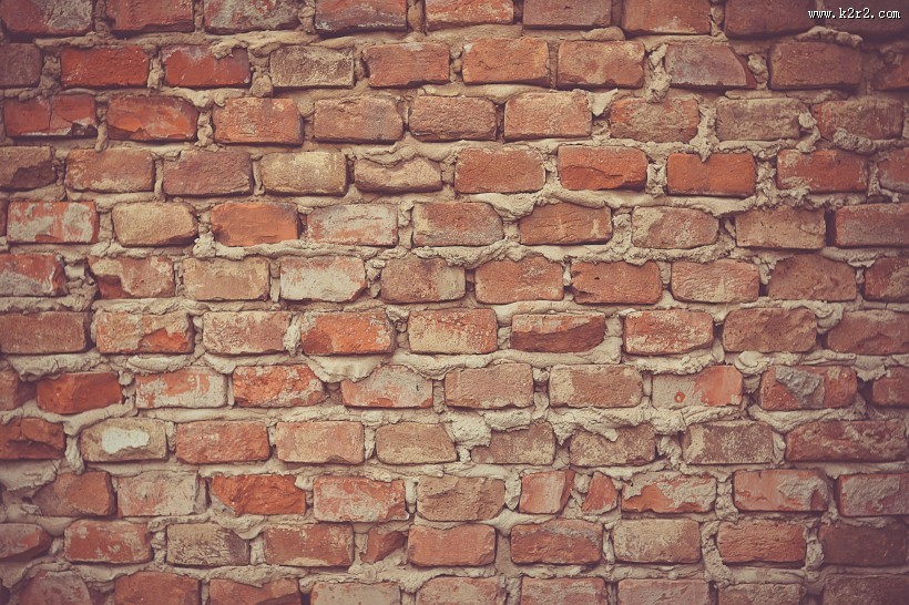 由砖和水泥建成的墙图片